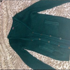 Green cardigan sweater.